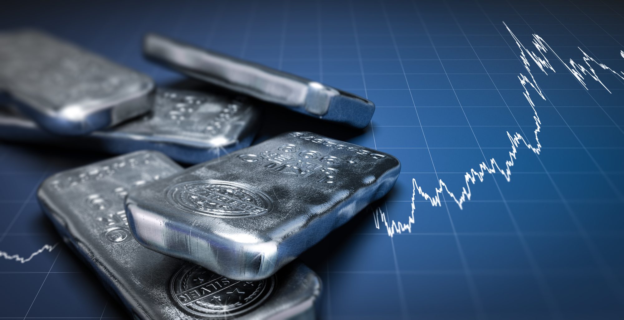 Silver bullion bars beside a rising price chart